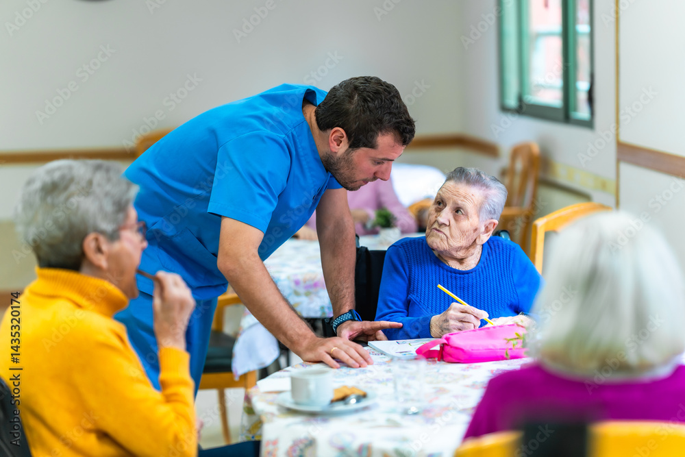 Male nurse assisting elderly woman with recreational activity in nursing home