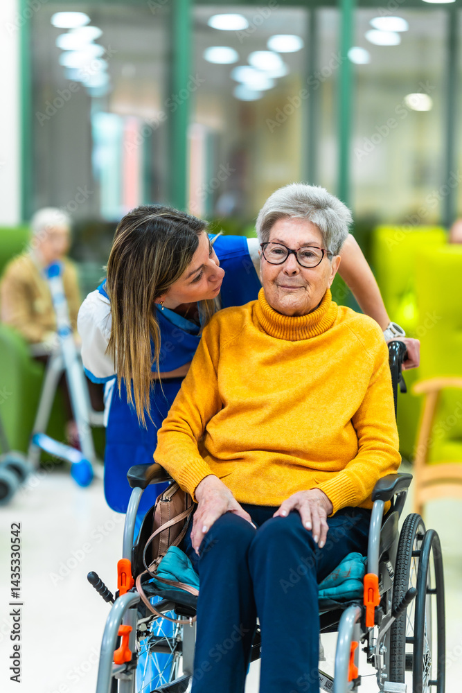Nurse assisting elderly woman in wheelchair at nursing home