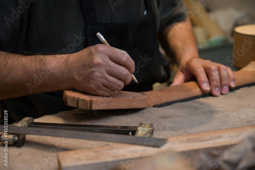 Obraz na plátně Luthier at work in his workshop
