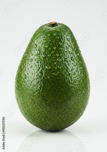 Fresh Avocado Covered in Water Droplets on White Background © singgih