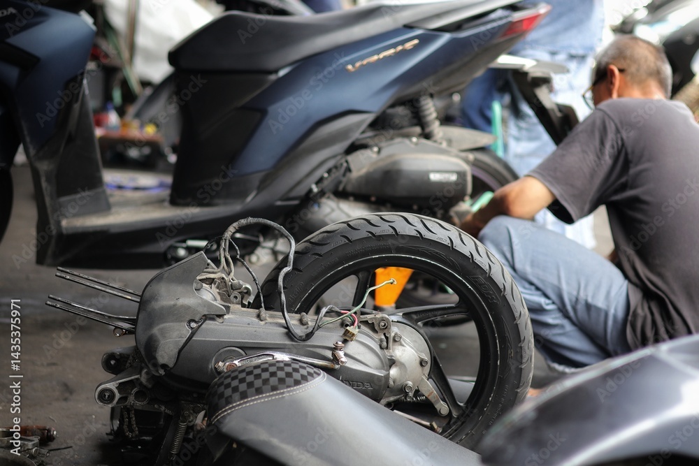 custom made wallpaper toronto digitalMechanic inspects and repairs damage of their customers' motorcycles at bengkel motor.