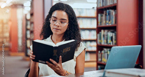Fotografie Woman, bible and reading at library, learning or theology student with ethics at university