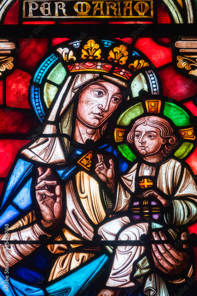 Obraz premium Stained glass (19th century) of Blessed Virgin Mary holding baby Jesus Christ in her arms