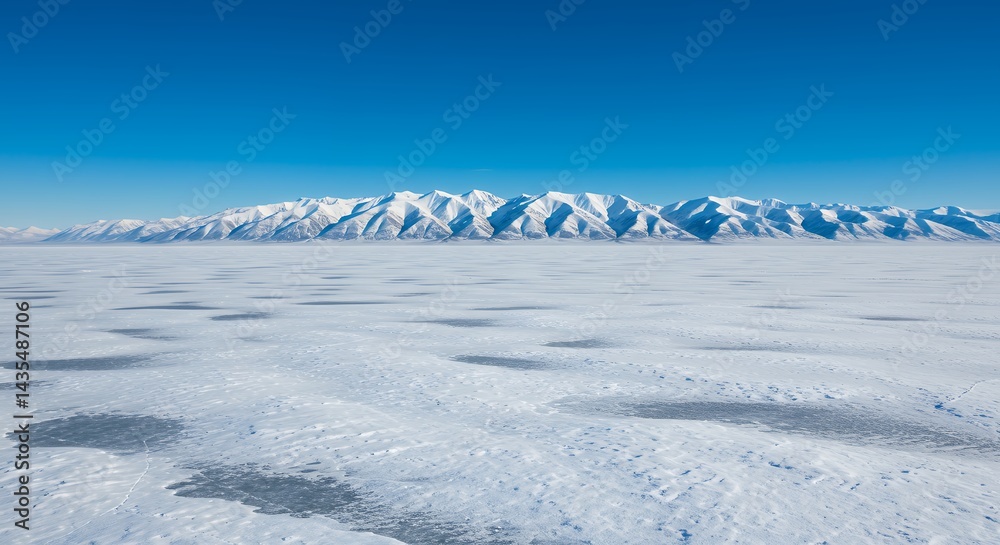 Obraz premium Aerial view snowy mountain range over clouds