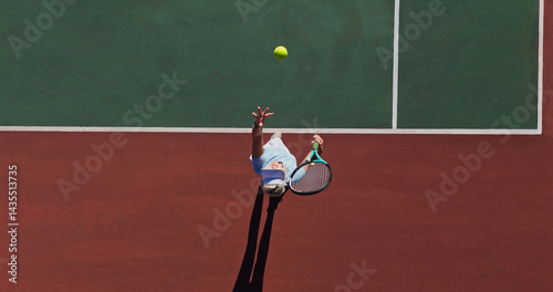 Ball, serve and person on outdoor tennis court with challenge, performance and action game from above. Racket, hit and professional athlete with fitness, wellness and competition at sports club
