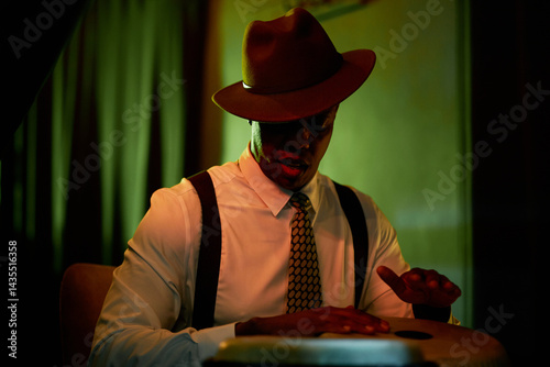 Sticker Medium shot of Black male drum musician wearing hat playing congas with soulful