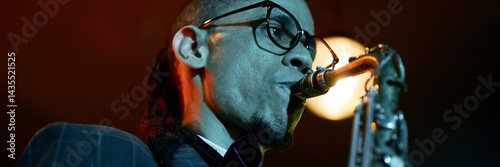 Wall Mural Website header shot of multiracial male musician playing jazz music during live