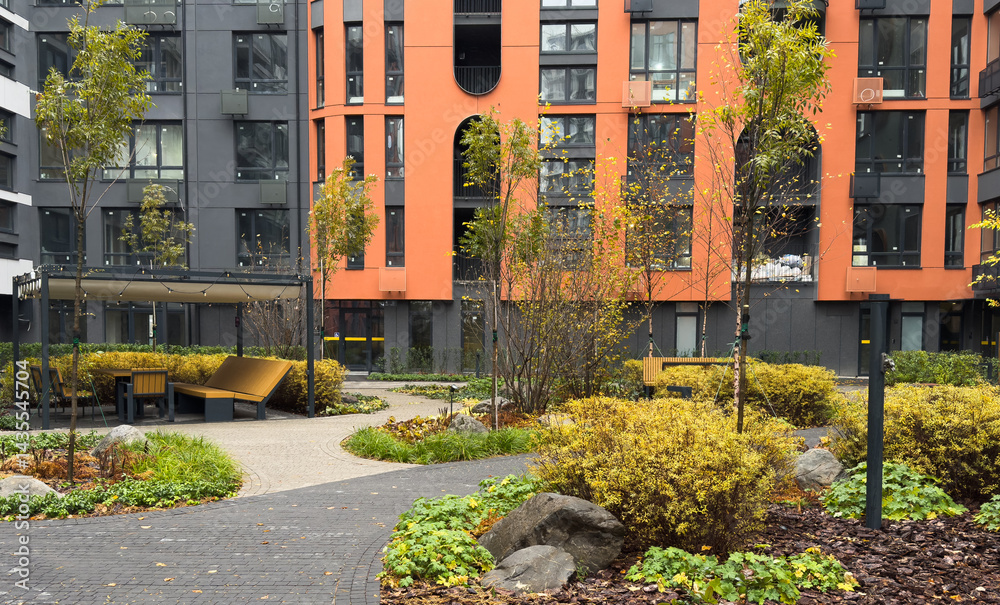 Residential area with ecological and sustainable green residential buildings, low-energy houses with apartments and green courtyard