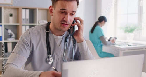 Male nurse, doctor using smartphone to call, busy chatting with patient online, giving consultation, advice, explaining recommendation, treatment, assignment, reception, scheduling appointment