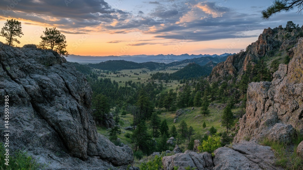 Fototapeta premium A scenic mountain valley at sunset with beautiful sky and trees
