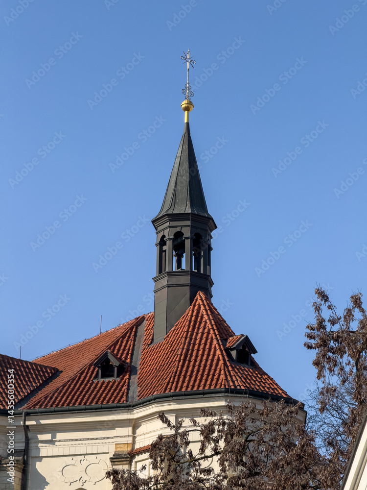 crucifix stands tall on the bell tower