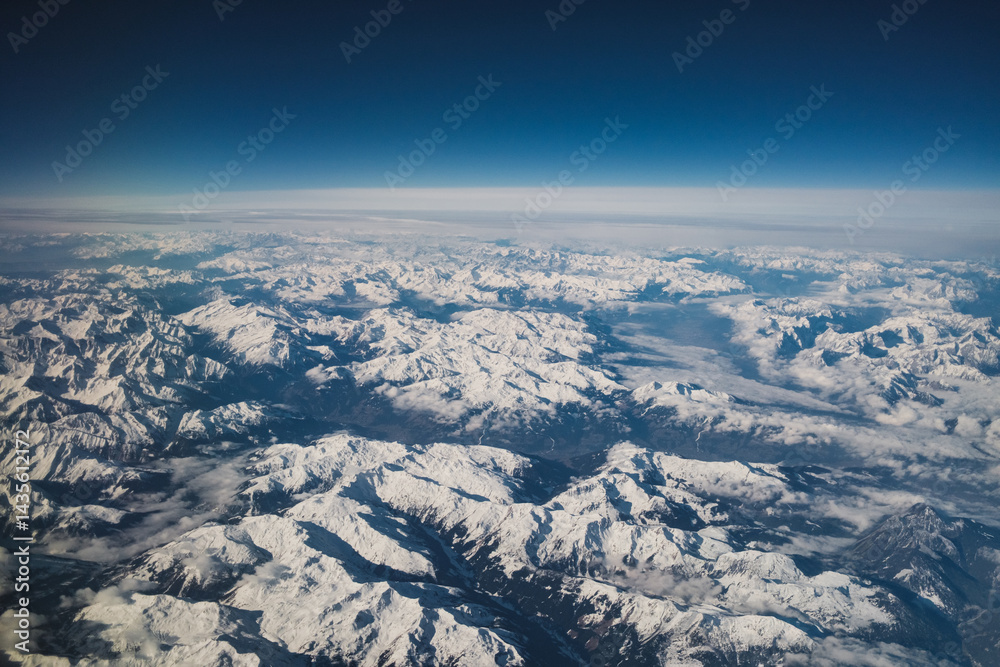 Snowy Mountain Tops Seen From Plane