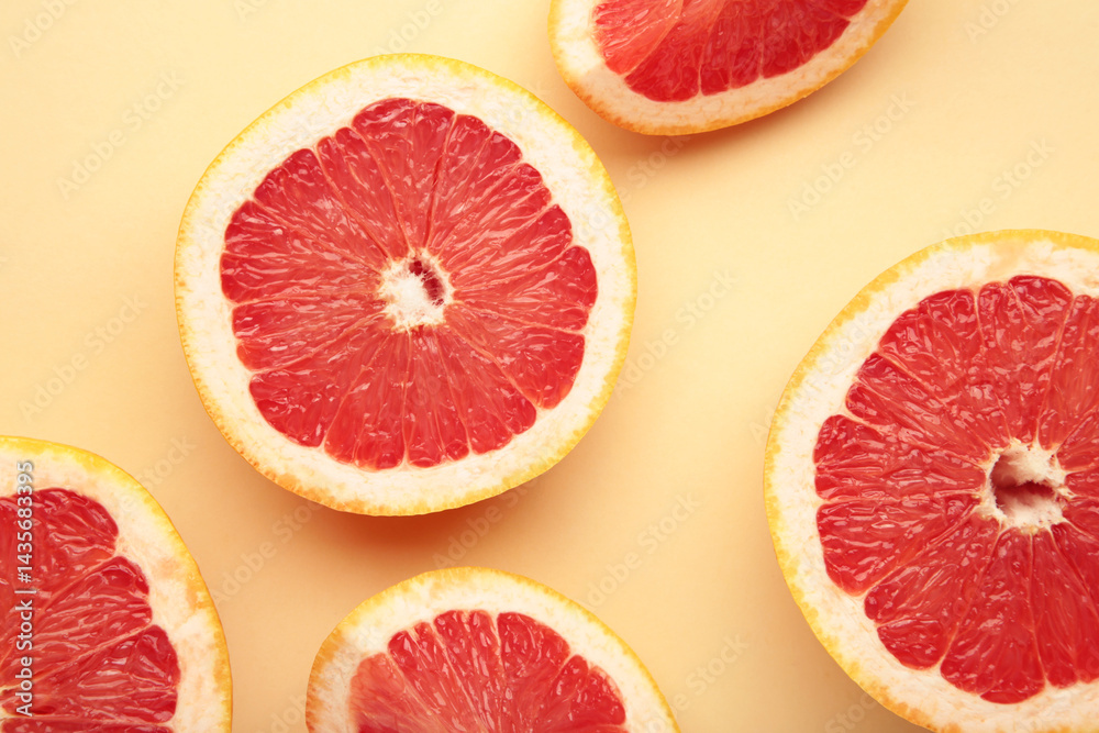 Fresh raw grapefruit on beige background. Space for text Fresh raw grapefruit on beige background. Space for text
