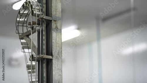 Close up view of an automated conveyor and control system in a food processing facility, highlighting modern industrial technology and production efficiency.