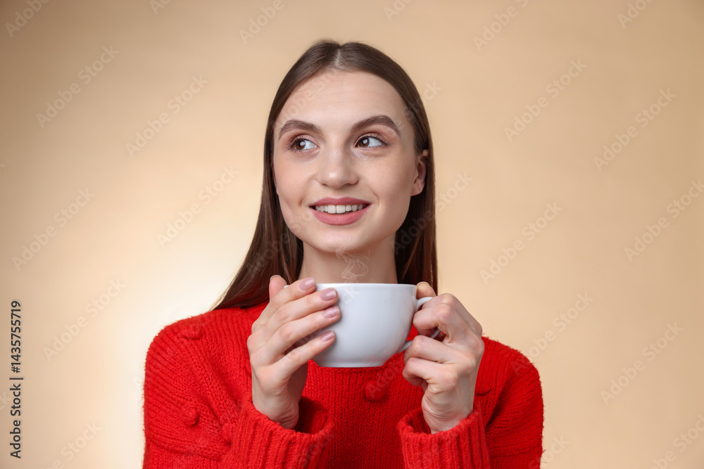 Smiling woman with cup of coffee on beige gradient background