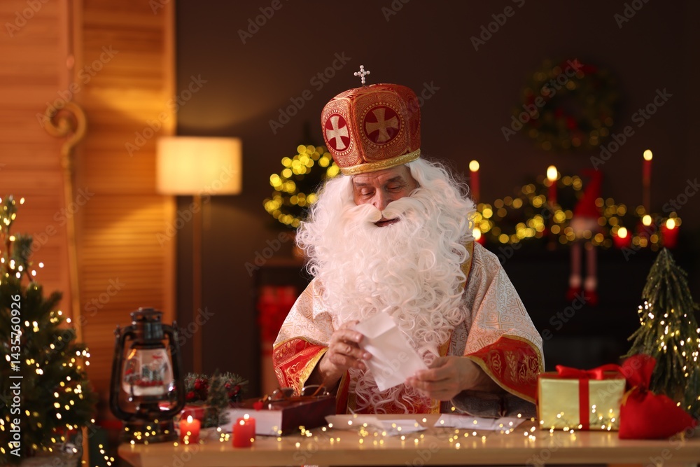 Saint Nicholas with letters at desk in room decorated for Christmas Saint Nicholas with letters at desk in room decorated for Christmas