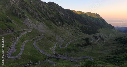 Panning right 180 degree motion at Dawn of the Transfagarasan Highway, mountain road on the Carpathian Mountains, Romania, Eastern Europe