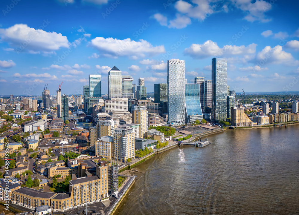 Panoramic aerial view of district Canary Wharf and the Docklands in London, England, during a sunny day
