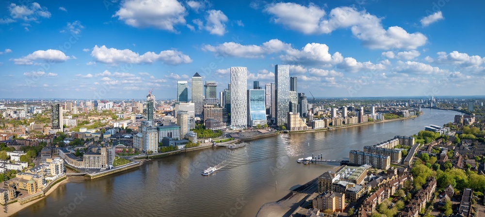 Panoramic aerial view of district Canary Wharf and the Docklands in London, England, during a sunny day