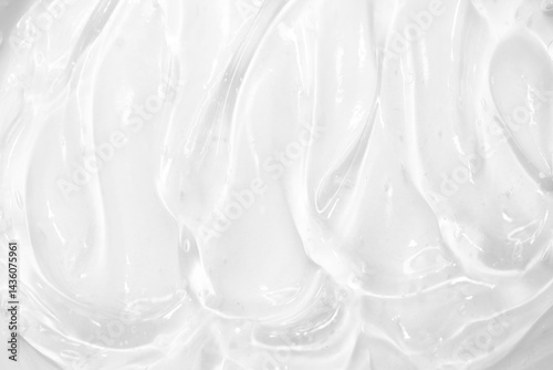 Cosmetic gel, serum transparent sample. Liquid cream with bubble texture. Gel texture of a cosmetic product. Clear liquid lotion for skin care.