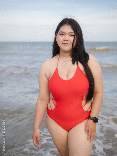 Woman young portrait asian fat chubby cute beautiful smile cheerful happy fun enjoy relax freedom in bikini swimwear body sexy plus size stand sea beach sunset ocean summer travel holiday evening time