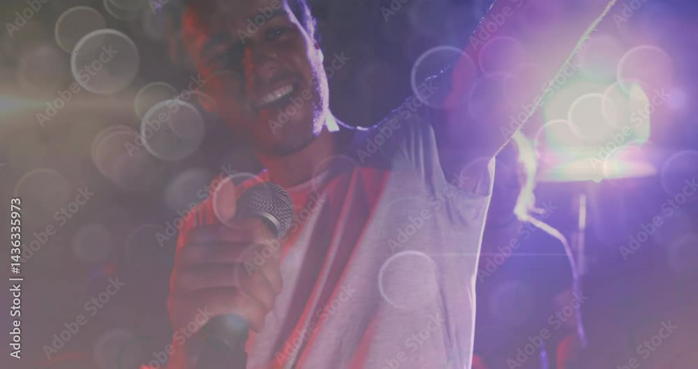 Lead singer holding microphone on concert stage, with animated music ...