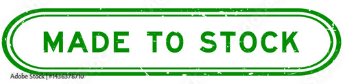 Grunge green made to stock word rubber seal stamp on white background