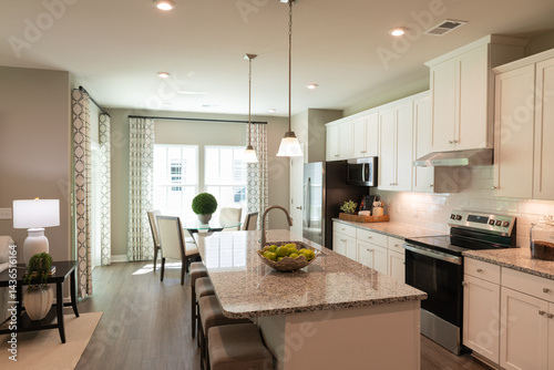 Interior Design of a beautiful modern kitchen with center island. Real estate concept.
