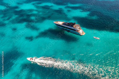 Wallpaper Mural Aerial view of beautiful luxury yacht and speed boat in blue sea in summer. Sardinia, Italy. Top drone view of boat, sea bay, transparent azure water. Travel. Tropical colorful landscape. Yachting Torontodigital.ca