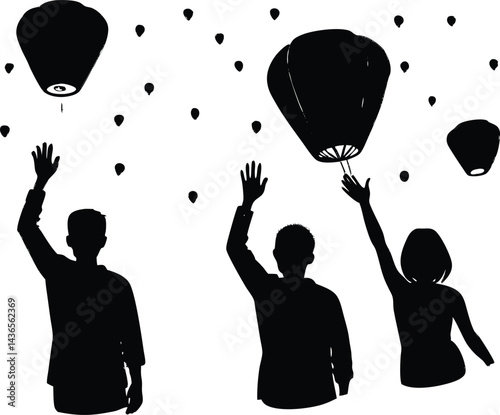 people releasing sky lanterns silhouette