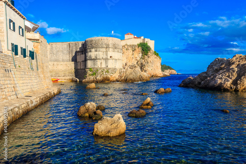 Fototapeta Naklejka Na Ścianę i Meble -  View of Fort Bokar, the city's ancient walls and the West Harbor in Dubrovnik, Croatia