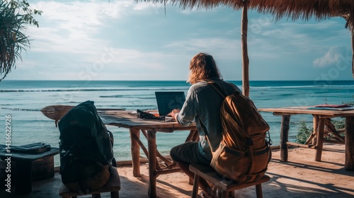 A digital nomad working remotely on a laptop from a tropical beachside café surrounded by palm trees and ocean views, embodying the freedom lifestyle