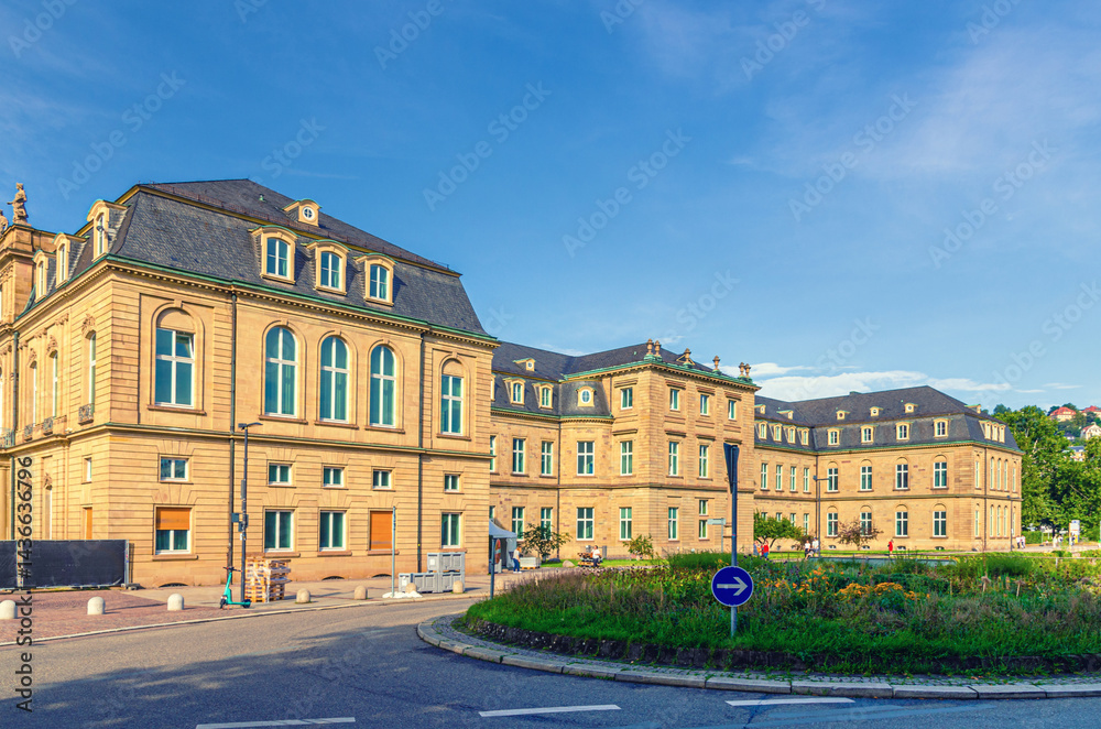 New Palace Neues Schloss Baroque style building lateral wing in old town Stuttgart city historic center with blue sky in sunny summer day, Baden-Württemberg state, Germany