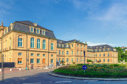 Obraz na płótnie New Palace Neues Schloss Baroque style building lateral wing in old town Stuttgart city historic center with blue sky in sunny summer day, Baden-Württemberg state, Germany w salonie
