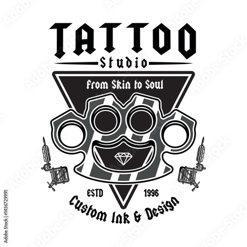 Vintage tattoo studio emblem with brass knuckles and tattoo machines. Classic monochrome vector illustration in retro style, perfect for badges, t-shirt prints and tattoo related designs