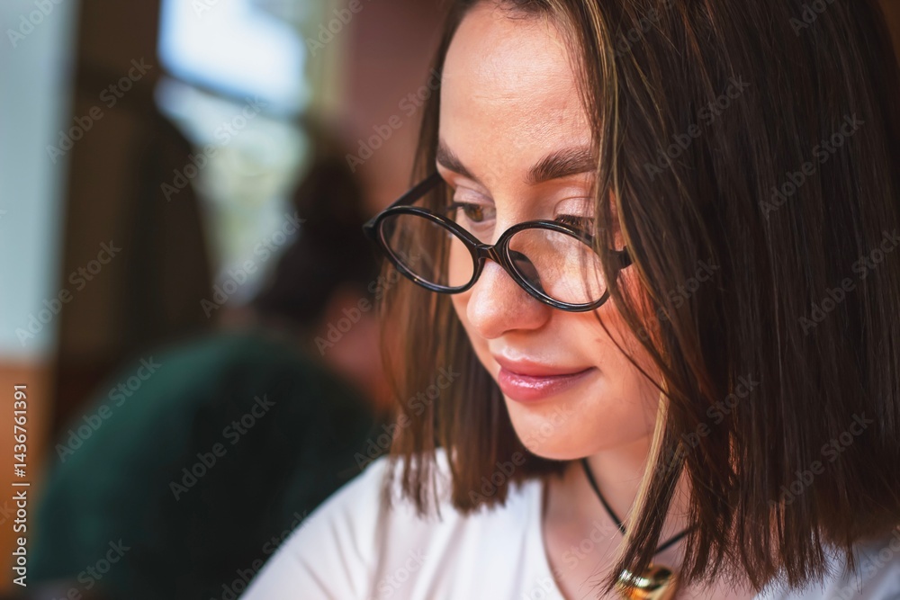 young woman in glasses