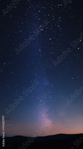 Stunning night sky filled with stars and the Milky Way, creating a serene cosmic landscape.