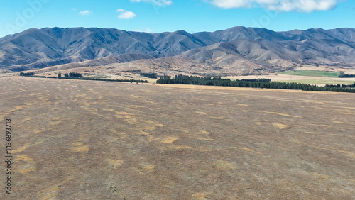 Remote rural arid desert like valley McKenzies Pass near Dog Kennel corner Tekapo photo