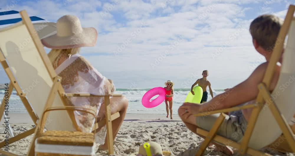 Sea, hug and family fun with kids, beach chair and embrace and running outdoor in sun. Happy, vacation and travel with love, support and care together and playing by ocean on summer holiday in Miami