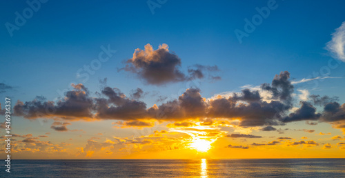 Sky on sunset. Beauty sunrise with sunlight background. Twilight, dramatic dawn, dusk, sunshine. Cloudy sunset. Sunset wallpaper. Sky sunset overlay. Peaceful horizon. Panorama of glow shiny sky.