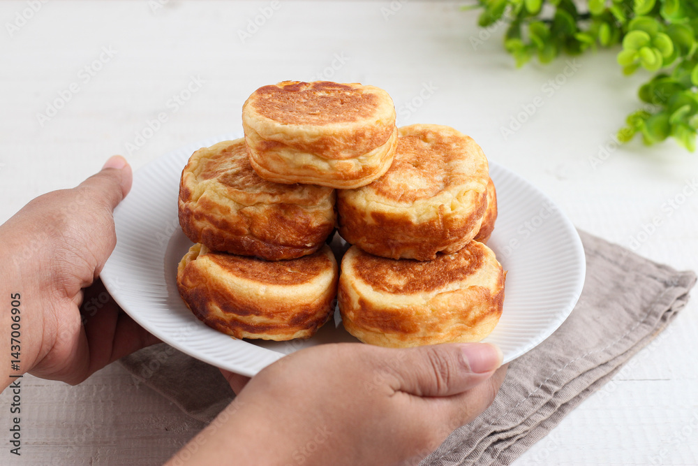 Kue Kamir. Kamir cake. served on a white plate. with copy space. originated from Pemalang, Middle Java, Indonesia. Kue Kamir. Kamir cake. served on a white plate. with copy space. originated from Pemalang, Middle Java, Indonesia.
