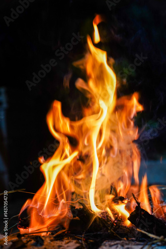 Bonfire makes fire, black background