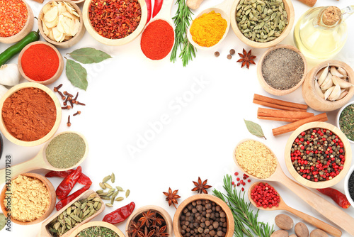 Obraz na płótnie Frame of different aromatic spices on white background, top view w salonie
