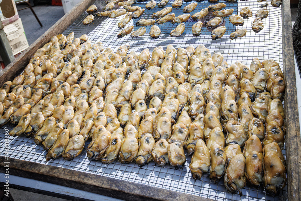 A Chinese Traditional Dried Gold Oysters on a Metal Grid