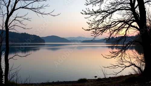 Serene Lake at Dusk with Silhouetted Trees