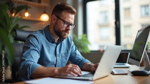 Small business owner working in office during Small Business Week  Entrepreneur managing business tasks  Office setting for small business owner  Focused small business professional