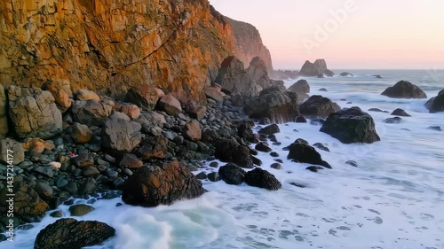 sunset by the beach with waves crashing scenery