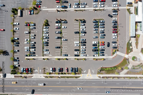 Aerial drone top-down view of a busy and full parking lot at a large medical provider in Beaverton, Oregon, with many parked cars and clearly marked driving lanes