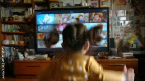 Wallpaper Mural A young girl watching cartoons on television from the back. Torontodigital.ca