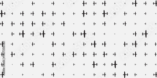 Seamless background pattern of evenly spaced black plane symbols of different sizes and opacity. Vector illustration on yellow background with stars